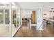Modern entryway features hardwood floors and an open floor plan that leads to the kitchen and dining room at 5969 S Humboldt Ct, Centennial, CO 80121