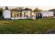 Well-kept lawn complements the modern architectural design of this inviting home with unique stone accents at 5969 S Humboldt Ct, Centennial, CO 80121