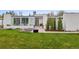 Inviting modern home with well-manicured lawn, stylish landscaping, and welcoming entrance at 5969 S Humboldt Ct, Centennial, CO 80121