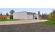 Modern home's exterior showcasing a clean driveway leading to a spacious two-car garage and landscaped yard at 5969 S Humboldt Ct, Centennial, CO 80121