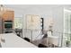 Modern kitchen area with stainless steel appliances, white countertops, bar seating, and sleek modern decor at 5969 S Humboldt Ct, Centennial, CO 80121