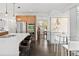Contemporary kitchen with an island, stainless steel appliances, wood cabinetry, and modern pendant lighting at 5969 S Humboldt Ct, Centennial, CO 80121