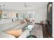 Bright living room with a fireplace, large windows, and a stylish glass coffee table and ceiling fan at 5969 S Humboldt Ct, Centennial, CO 80121