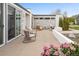Modern patio with comfortable seating, a stylish fire pit, and beautiful landscaping details at 5969 S Humboldt Ct, Centennial, CO 80121