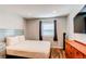 Bedroom with wood floors, closet, and natural light at 2870 S Ursula St, Aurora, CO 80014