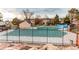 Community pool is fenced in with red brick along the side and in the distance at 2870 S Ursula St, Aurora, CO 80014