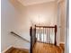 The foyer features wood-look floors, wooden railings, and a view of the front door and chandelier at 2870 S Ursula St, Aurora, CO 80014
