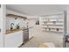 Basement bar area with countertop, wine storage, beverage fridge, sink, and shelving at 6681 Secrest Cir, Arvada, CO 80007