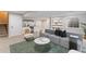 Wide angle view of basement showcasing a bar, shelving, living area and open floor plan at 6681 Secrest Cir, Arvada, CO 80007