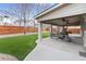Covered patio offers additional living space with seating, ceiling fans, and outdoor lighting at 6681 Secrest Cir, Arvada, CO 80007