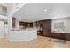 Kitchen featuring dark wood cabinets, granite countertops, and stainless steel appliances at 6681 Secrest Cir, Arvada, CO 80007