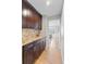 Kitchen featuring custom cabinetry and granite countertops at 6681 Secrest Cir, Arvada, CO 80007