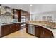 Well-equipped kitchen with stainless steel appliances and stylish backsplash at 6681 Secrest Cir, Arvada, CO 80007