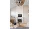 Bright living room with vaulted ceilings, a fireplace, and comfortable seating area at 6681 Secrest Cir, Arvada, CO 80007
