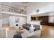 Open-concept living room with soaring ceilings, a view of the upper level, and a modern kitchen at 6681 Secrest Cir, Arvada, CO 80007