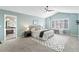 Tranquil main bedroom with a vaulted ceiling, ceiling fan, and stylish rug at 6681 Secrest Cir, Arvada, CO 80007