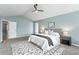 A beautiful bedroom featuring neutral walls, ceiling fan, and a decorative rug at 6681 Secrest Cir, Arvada, CO 80007