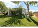 Backyard with lush green lawn and mature trees providing ample shade and privacy at 3740 Iris Ave # B, Boulder, CO 80301