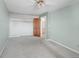 This bedroom features carpeted floors, an closet with wooden doors, and ample space at 3740 Iris Ave # B, Boulder, CO 80301
