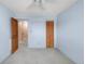 This bedroom features carpeted floors, an closet with wooden doors, and ample space at 3740 Iris Ave # B, Boulder, CO 80301