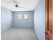 This bedroom features a ceiling fan, carpeted floors, and a window offering natural light at 3740 Iris Ave # B, Boulder, CO 80301