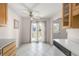 Bright and airy dining area with updated lighting, hardwood floors, and slider to a private outdoor patio area at 3740 Iris Ave # B, Boulder, CO 80301