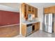 This eat-in kitchen features stainless steel appliances, shaker cabinets and hardwood floors in adjacent dining area at 3740 Iris Ave # B, Boulder, CO 80301