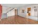 Open-concept living space features hardwood floors and staircase near an updated kitchen and bright natural light at 3740 Iris Ave # B, Boulder, CO 80301