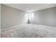 Spacious bedroom with grey walls, carpet flooring, and an adjacent closet at 4750 S Dudley St # 7, Littleton, CO 80123