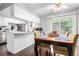 Inviting dining area with sliding glass doors and a breakfast bar at 1977 S Oakland Way, Aurora, CO 80014