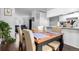 Open dining room connected to a cozy living room and a well-lit kitchen area at 1977 S Oakland Way, Aurora, CO 80014