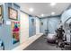 Basement gym featuring workout equipment, rubber flooring, and blue walls at 1977 S Oakland Way, Aurora, CO 80014