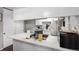 Clean kitchen featuring ample countertop space and modern appliances at 1977 S Oakland Way, Aurora, CO 80014