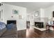 Cozy living room with a fireplace and modern finishes, perfect for relaxing at 1977 S Oakland Way, Aurora, CO 80014