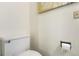 Clean, simple toilet area with white fixtures against neutral walls at 1977 S Oakland Way, Aurora, CO 80014