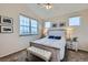 Inviting bedroom with vaulted ceilings, a cozy bed, and large windows offering natural light at 1335 Villa Grv # 30, Monument, CO 80132