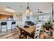 Dining area featuring stylish table and chairs, complemented by wood-look flooring at 1335 Villa Grv # 30, Monument, CO 80132
