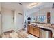 Open concept eat-in kitchen boasts stainless appliances and a seamless flow to the living area with a fireplace at 1335 Villa Grv # 30, Monument, CO 80132