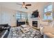 Cozy living room featuring a fireplace, comfortable seating, and natural light at 1335 Villa Grv # 30, Monument, CO 80132