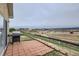 Outdoor patio with barbecue grill and view of the new home construction in the neighborhood at 1335 Villa Grv # 30, Monument, CO 80132