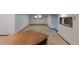 Expansive carpeted basement featuring a kitchenette area with a sink, perfect for entertaining at 2045 Pine Wood Rd, Sedalia, CO 80135