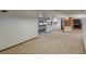 Spacious basement with carpet floors featuring a partial kitchenette, perfect for entertaining guests at 2045 Pine Wood Rd, Sedalia, CO 80135