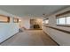 Finished basement with stone fireplace and carpeted floors, ready for entertaining or relaxing at 2045 Pine Wood Rd, Sedalia, CO 80135