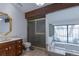 Bright bathroom features a soaking tub, marble countertop, and a glass-enclosed shower at 2045 Pine Wood Rd, Sedalia, CO 80135