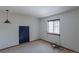 This bedroom has neutral carpet, a window with blinders, and a modern hanging light fixture at 2045 Pine Wood Rd, Sedalia, CO 80135