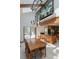 Open dining area with a chandelier, breakfast bar, and sliding doors leading to outdoor space at 2045 Pine Wood Rd, Sedalia, CO 80135