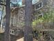 Stone home with large windows, situated on a wooded lot at 2045 Pine Wood Rd, Sedalia, CO 80135