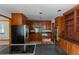 Spacious kitchen featuring wood cabinets, stainless steel appliances, and dark countertops at 2045 Pine Wood Rd, Sedalia, CO 80135