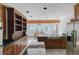 Bright kitchen with wood cabinets, stainless steel appliances, breakfast bar, and tiled flooring at 2045 Pine Wood Rd, Sedalia, CO 80135