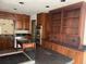 Kitchen with wooden cabinets, stainless steel appliances, and granite countertops at 2045 Pine Wood Rd, Sedalia, CO 80135